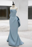Light blue evening gown on a mannequin against a neutral background