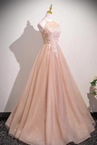 Beige evening gown on a mannequin against a plain background