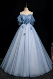 Light blue evening gown on a mannequin against a black background