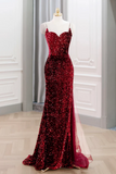 Red sequin evening gown on a mannequin against a neutral background
