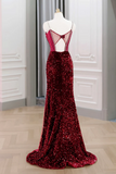 Red sequin evening gown on a mannequin against a neutral wall.