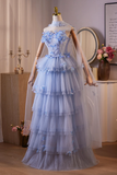 Light blue floral dress on a mannequin against a neutral background