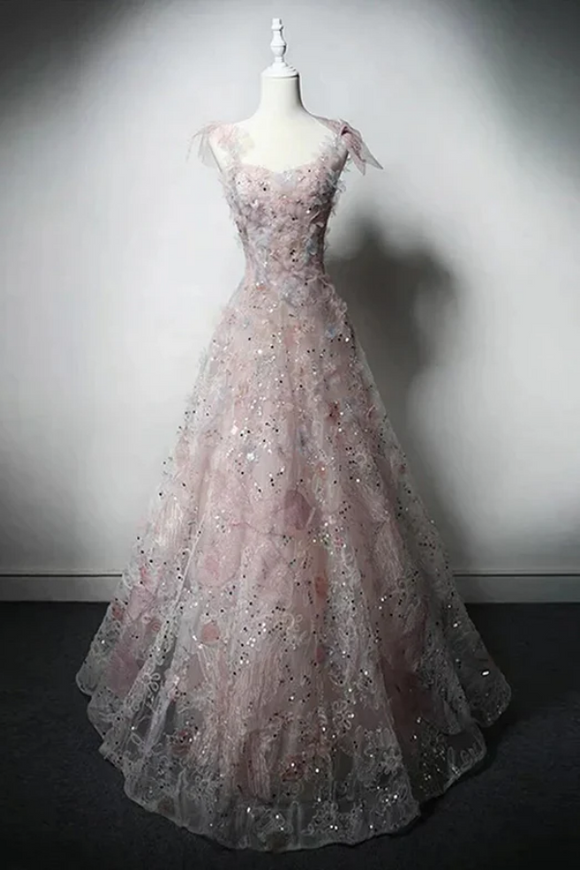 Elegant evening gown with floral details on a mannequin against a neutral background