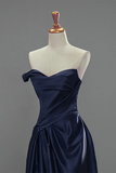 Navy blue off-shoulder dress on a mannequin against a gray background