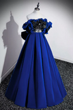 Blue evening gown on a mannequin against a plain background