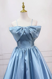Light blue dress with a large bow on a mannequin against a white background