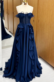 Navy blue evening gown on a mannequin against a wooden wardrobe background
