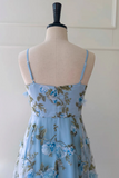 Light blue floral dress on a mannequin against a white background