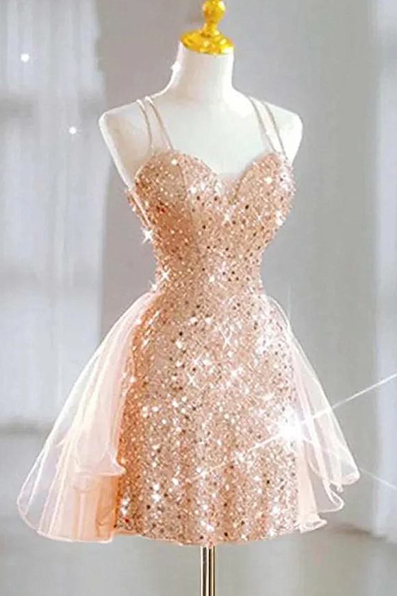 Rose gold sequin dress on a mannequin against a light background