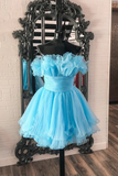 Light blue dress on a mannequin in front of a decorative mirror.
