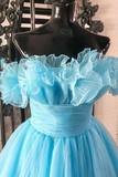 Light blue dress with ruffled top on a mannequin against a decorative background