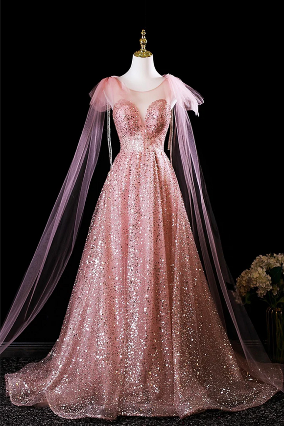 Pink sequin gown with cape on a mannequin against a black background