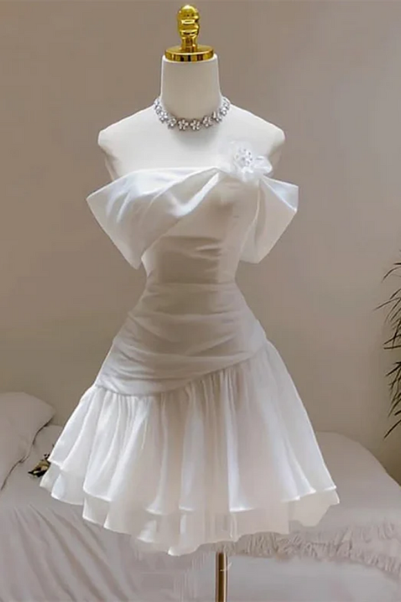 White dress on a mannequin against a neutral background