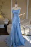 Light blue evening gown on a mannequin against a neutral background