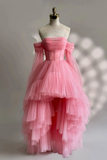Pink tiered dress on a mannequin against a neutral background