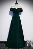 Green off-shoulder evening gown on a mannequin against a plain background