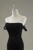Black dress with lace details on a mannequin against a gray background