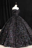 Black sequin evening gown on a mannequin against a black background