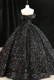 Black sequin evening gown on a mannequin against a black background