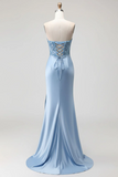 Light blue evening gown with lace detailing on a mannequin against a white background