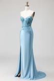 Light blue evening gown on a mannequin against a white background