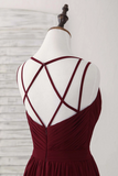 Red dress with criss-cross back on a mannequin against a white background