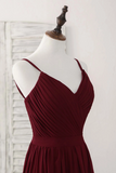 Burgundy dress on a mannequin against a white background
