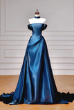 Blue evening gown on a mannequin against a neutral background
