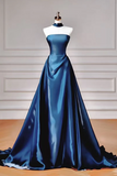 Blue satin evening gown on a mannequin against a neutral background