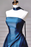 Blue dress on a mannequin against a neutral background