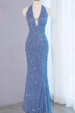 Blue sequin evening gown on a mannequin against a white curtain.
