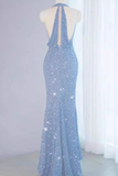 Blue sequin evening gown on a mannequin against a white curtain background