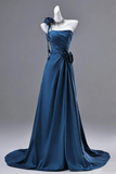 Blue evening gown on a mannequin against a gray background