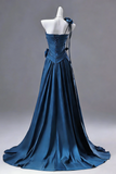 Blue evening gown on a mannequin against a gray background