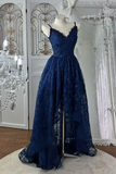 Navy blue lace evening gown on a mannequin in a decorative room with chandelier.