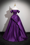 Purple evening gown on a mannequin against a neutral background