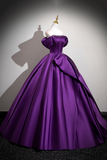 Purple ball gown on a mannequin against a neutral background
