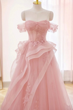 Pink evening gown on a mannequin against a light background