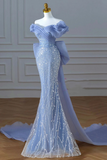Blue evening gown on a mannequin against a neutral background