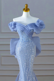 Blue evening gown with sequin detailing on a mannequin against a neutral background