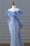 Blue evening gown on a mannequin against a neutral background