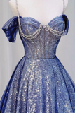 Blue sparkly dress on a mannequin against a plain background