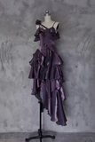 Purple ruffled dress on a mannequin against a textured gray wall