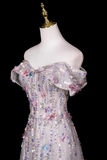 Elegant off-shoulder dress with sequins on a mannequin against a black background