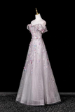 Elegant evening gown on a mannequin against a black background