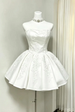 White lace dress on a mannequin against a neutral background