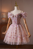 Delicate floral dress on a mannequin against a blurred indoor background