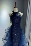 Navy blue sequin dress on a mannequin against a neutral background
