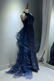 Navy blue evening gown on a mannequin against a neutral background