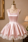 Pink satin dress on a mannequin with a beige wall and lamp in the background